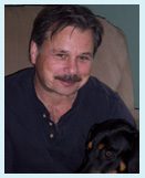 A man with a mustache and a dog